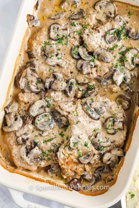 These Mushroom Pork Chops are smothered in a creamy sauce and baked until fork-tender. Serve over egg noodles or mashed potatoes for the perfect meal!  #spendwithpennies #creamofmushroomporkchops #recipe #maindish #easy #creamy Pork Chops Oven Baked, Oven Pork Chops, Pan Seared Pork Chops, Baked Pork Chops Oven, Mushroom Pork Chops, Breaded Pork Chops, Baked Mushrooms, Seared Pork Chops, Pork Chop Recipes Baked