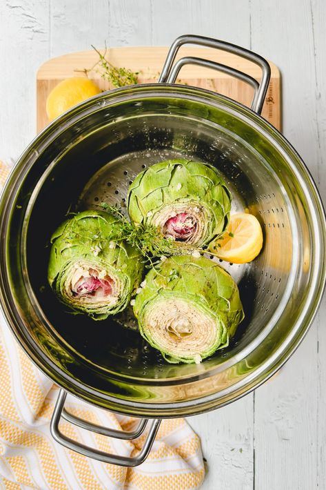 This delicious Steamed Artichoke recipe with lemon butter infused with fresh thyme is a perfect appetizer for spring gatherings. The tender petals seasoned with salt, pepper, and garlic are a treat you won't want to miss. Steamed Artichoke, Steamed Artichokes, Artichoke Recipe, Steam Artichoke, How To Cook Artichoke, Recipe With Lemon, Asparagus Soup, Artichoke Recipes, Super Food