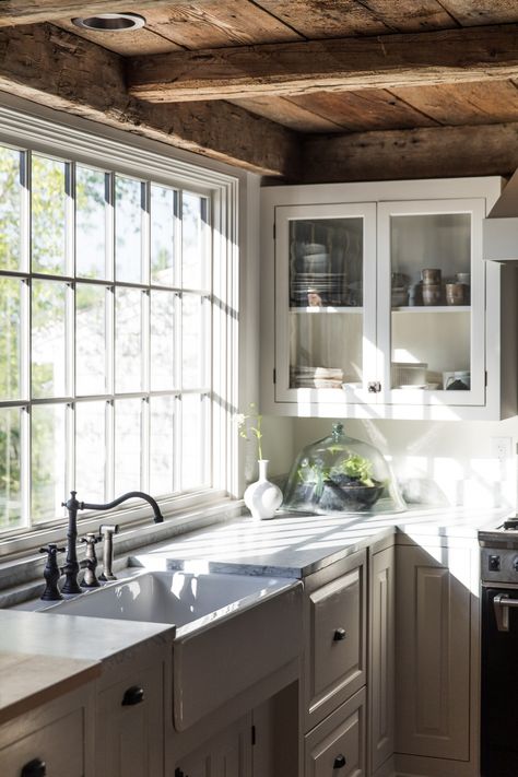 Step Inside a Farmhouse Kitchen in Maine with Modern Upgrades White Colonial Kitchen, Gally Kitchen Layouts, Rustic Kitchen Sinks, Paned Windows, Brown Farmhouse, Windows Kitchen, Materials Board, Vintage Style Kitchen, Farmhouse Kitchen Lighting