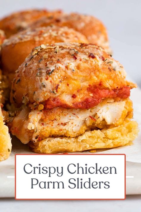 These incredible chicken parm sliders are the perfect appetizer or entrée for parties, showers, game days, or anytime you want something delicious and bite-sized. Crispy chicken strips are topped with rich marinara and melted provolone, sandwiched between dinner rolls covered in a seasoned butter-parmesan sauce. Chicken Parm Sliders, Parm Sliders, Crispy Chicken Strips, Chicken Parmesan Sliders, Baked Chicken Strips, Crispy Chicken Breast, Slider Sandwiches, Chicken Parm, Tailgate Food