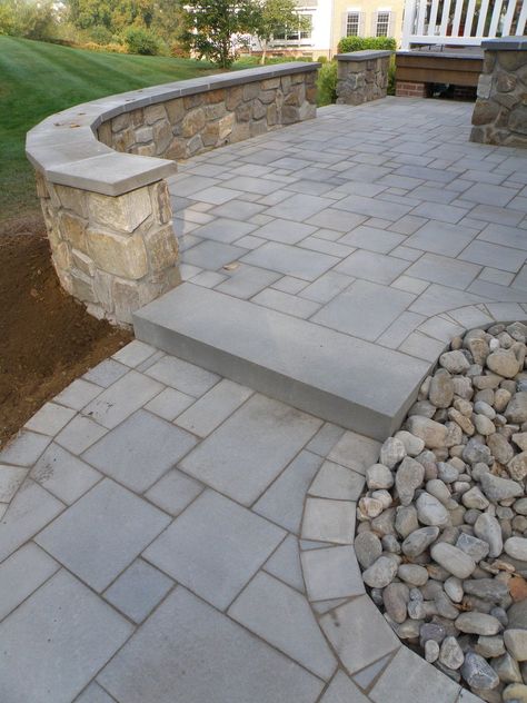 Stone Wall Patio, Stamped Concrete Patio Bluestone, Paver Patio With Retaining Wall, Patio Inspiration Backyard, Patio With Stone Wall, Outdoor Patio Stone, Paver Stone Patio, Decorative Concrete Patio, Stone Patio Designs