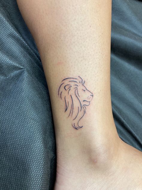 #tattoo #liontattoo # #womentattooideas  #tattooideas #tattooartist #tattoosforwomen  #tattoodesign Lion Tattoo Simple Design, Lion Outline Tattoo For Women, Simple Lion Head Tattoo, Small Simple Lion Tattoo, Fine Lion Tattoo, Small Lion Outline Tattoo, Lion Line Tattoo For Women, Lion Cute Tattoo, Lion Small Tattoo For Women