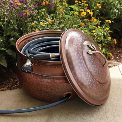 It's inevitable: You have to own a hideous hose if you want your lawn to be lush and green — but that doesn't mean it has to become a total eyesore. This hammered copper pot ($112, amazon.com) lets you hide this item out of sight when not in use. Hose Pot, Hose Box, Low Maintenance Garden Design, Garden Hose Storage, Garden Hose Holder, Hose Storage, Lawn Care Tips, Hose Holder, Garden Hoses