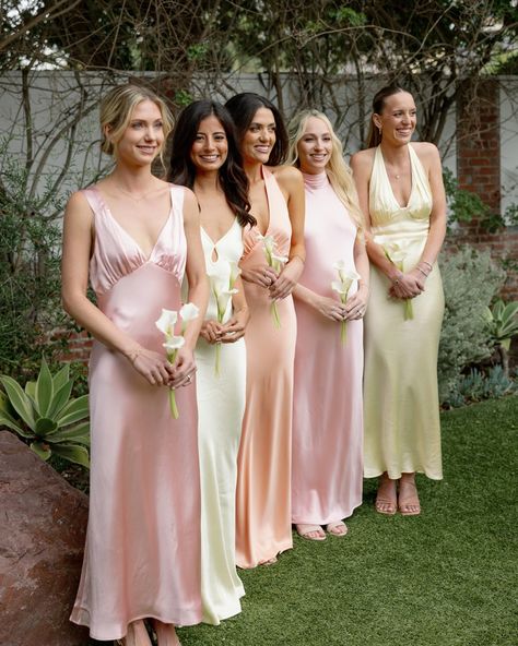 A pastel dream of @amandawishi wedding in sunny California! Capturing the beauty of these delicate, flowing pieces all together - the soft pinks, peaches, and sunny yellows create such a dreamy, romantic vibe. When you can’t decide which one you love most, dress your bridesmaids in all. Because times of all matched same bridal party are so done, hey ! #bridesmaids #bridalparty #bridesmaidsdresses Pastel Bridal Party, Pastel Pink Bridesmaid Dresses, Bridesmaid Palette, Groomsmen Colours, Pink Bridal Party, Pastel Bridesmaids, Wildflower Wedding Theme, Peach Bridesmaid Dresses, Peach Bridesmaid