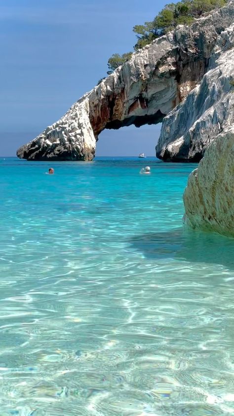 Il fascino dell’arco di Cala Goloritzé: un angolo di paradiso nascosto tra le acque cristalline della costa di Baunei. 🌊✨ 📽️ @costadibaunei ⁣⁣📍Cala Goloritzè, Baunei #costadibaunei #calagoloritzè #baunei #santamarianavarrese #sardegna #sardinia #cerdeña #calagoloritze #ogliastra #lifeinsardegna #vacation #italia #italy #earthpix #travel #beautifuldestinations #visititaly #summervibes #travelinspiration #travelgram | Costa di Baunei | Crystal Clear Water, Sardinia, Clear Water, Crystal Clear, Paradise, Spa, Italy, Water, Travel