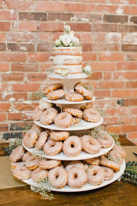 Donut Wedding Table, Donut Stands Wedding, Donut Cake For Wedding, Wedding Center Ideas Centerpieces, Cupcakes And Donuts Wedding Display, Wedding Cake With Donuts Around, Tiered Donut Cake, Donut And Cupcake Dessert Table, Doughnut Tier Cake