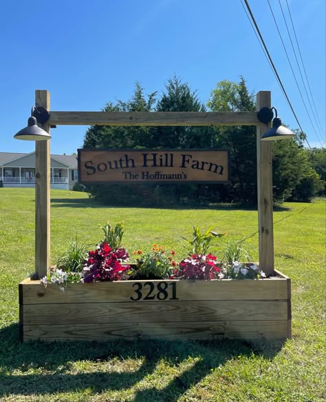 Wood Driveway Entrance, Mailbox With Farm Sign, Wood Farm Signs Entrance, Ranch Address Sign Ideas, End Of Driveway Decor, Shop Landscaping Ideas, Diy Driveway Sign, Driveway Entrance Flower Bed Ideas, Address Flower Box Diy