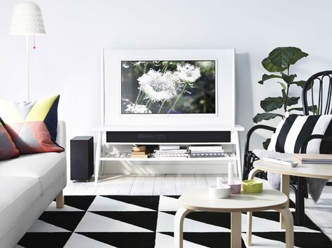 A white living room with an UPPLEVA HIMNA TV in white, an orange KARLSTAD sofa and an IKEA PS 2014 grid rug Ikea Svalsta, Grid Rug, Karlstad Sofa, Black White Rooms, Scandi Living Room, Tv 40, Coffee Table Inspiration, Ikea Couch, Ikea Ideas