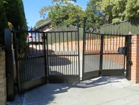 Bulleen - Bi-Fold Gates with Sloping Driveway - Melbourne BiFold Gates | Security Gates Melbourne | Gate Automation Sloping Driveway, Automatic Gates Driveways, Sliding Gates, Gate Automation, Security Gates, Garage Door Installation, Garage Door Design, Sliding Gate, Kick Plate