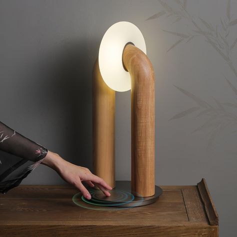 This U-Shaped Xuanguang Table Lamp is both beautiful and practical. It features a Tianmen Xuanguang, an acrylic lampshade, a metal base to enhance load-bearing capacity, and a solid wood lamp body with whole wood carving natural texture. It has a touch switch for easy use and an optical light guide for a soft and natural glow. An excellent combination of form and function. 
 If you have any questions about our products, please contact us and we will get back to you within 24 hours. 
 Original design of the same series of solid wood products, click to learn more>>> 
   Product Size 
 Size: Dia 20cm x   H 45cm /  7.9 x H 17.7 
 
 Details 
 Material:  Wood, Acrylic, Metal. 
 Light source: Integrated LED (LED lights are fully built into the fixture and cannot be replaced). 
 Kelvin range: Warm Beautiful Product Design, Arch Light, Arch Lamp, Wood Lamp Design, Tiffany Style Table Lamps, Oak Plywood, Light Guide, Wood Arch, Kitchen Island Chandelier