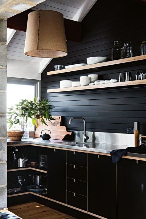 a chic black farmhouse kitchen with wooden planks, sleek black plywood cabinets and a metal countertop plus a burlap lamp Stainless Steel Benchtop, Black Plywood, Accent Wall In Kitchen, Modern Home Decor Kitchen, Plywood Kitchen, Plywood Interior, Cabinets Makeover, Cypress Wood, Wood Walls