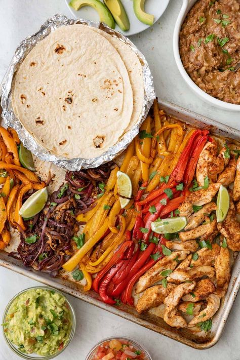 These chicken fajitas are baked in the oven on a sheet pan for a fuss free family meal that is full of flavor. Made with an easy homemade fajita seasoning. Healthy Sheet Pan Fajitas Chicken, Damn Delicious Sheet Pan Chicken Fajitas, Lunch Oven Recipes, Easy Oven Baked Sheet Pan Chicken Fajitas, One Pan Easy Dinners, One Sheet Fajita Chicken, Fajita For A Crowd, All Food Group Meals, Dinner For Entertaining Friends