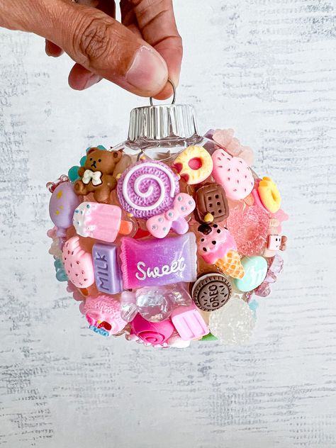 Barbie-inspired ornament that's absolutely enchanting! This little gem is sprinkled with cute charms that take me right back to my childhood dream world. Candy Charm: Because who can resist Barbie's sweet style and candy-colored world? This ornament is not just a decoration; it's a delightful trip down memory lane, reminding us to dream big, sparkle brighter, and never stop having fun! may your days be filled with joy,and a touch of Barbie magic! #BarbieOrnament #HolidayMagic #DreamBigBarbie Christmas Candy Ornaments Diy, Diy Barbie Ornaments, Barbie Christmas Ornaments, Christmas Kawaii, Diy Sprinkles, Barbie Christmas, Candy Balls, Childhood Dream, Barbie Inspired