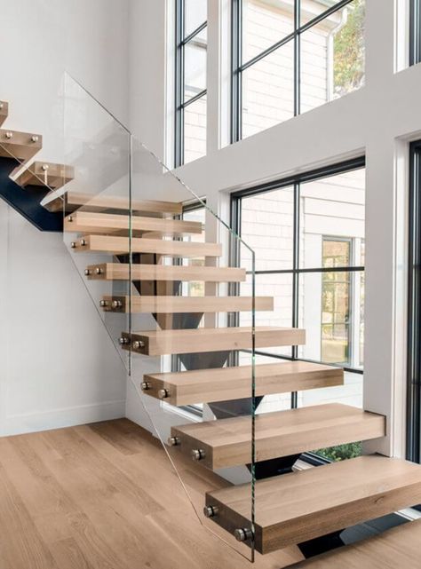 Floating stairs with glass railings. The mono stringer is made of steel and the treads are wood with standoffs holding the glass railing. Staircase Panels, Glass Stairway, Balustrade Staircase, Stair Panels, Staircase Balustrade, Stair Balustrade, Stairway Railing, Staircase Detail, Staircase Glass