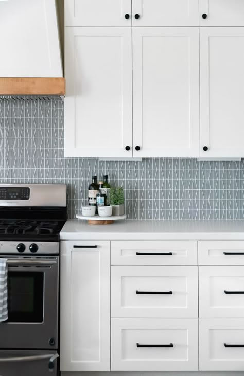 Kitchen With Blue Island, White Cabinets Black Hardware, Airy Farmhouse, Black Kitchen Hardware, Matte Black Cabinet Hardware, Blue Backsplash Kitchen, Backsplash Kitchen White Cabinets, White Shaker Kitchen Cabinets, Black Cabinet Hardware