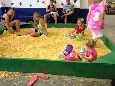 A corn box instead of sand. Brilliant idea, no sand do deal with. Will be doing this for Ky and Zoe. Kinetic Sand Farm, Corn Sandbox Sand Boxes, Sand Toy Storage Outdoor Play, Sand Box Toys For Kids, Rectangular Sand Bags For Daily Use, Playground Design, Sandbox, Kids Boxing, Fall Festival