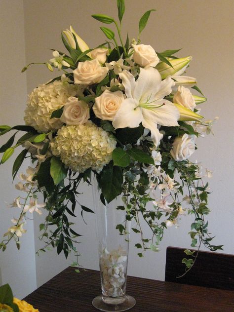 Tall centerpiece arrangement in whites and greens -- Casablanca Lilies, Hydrangea, Vendela Roses, Dendrobium Orchids, Ivy, Ruscus - design by Heather Murdock of The Blue Orchid Altar Flowers, Hydrangea Centerpiece, Large Flower Arrangements, Flower Arrangement Designs, Medieval Wedding, Church Flower Arrangements, Tall Centerpieces, Church Flowers, Modern Flower Arrangements