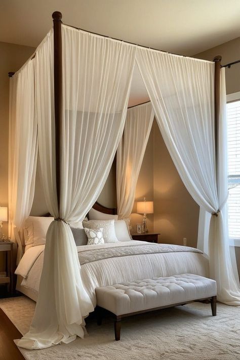 Canopy beds have long been associated with luxury and romance. These stunning centerpieces can instantly elevate your bedroom's ambiance and create a cozy, intimate space. Here are 15 inspiring canopy bed ideas to help you design the bedroom of your dreams. Small Room Big Bed, Butterfly Organization, Victorian Inspired Bedroom, Wooden Canopy Bed, Wood Canopy Bed, Luxury Bedrooms, Canopy Bed Frame, Earthy Bedroom, Bedroom Ambiance