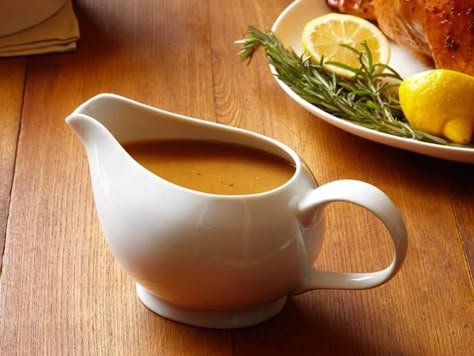 Get Classic Turkey Gravy Recipe from Food Network Homemade Turkey Gravy, Turkey Giblets, Classic Turkey, Turkey Gravy Recipe, Flavored Butter, Turkey Gravy, Food Network Magazine, Gravy Recipe, Gravy Recipes