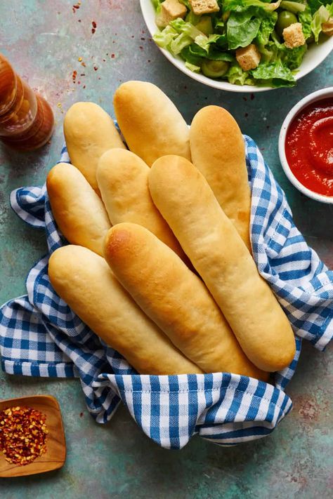 Breadsticks in a napkin with marinara and salad on the side Discard Pasta Noodles, French Bread Sourdough Discard, Sourdough Breadsticks Discard, Sourdough Breadsticks Quick, Sourdough Discard Breadsticks Recipe, Sourdough Discard Baguette, Sourdough Discard Bread Sticks, Sourdough Discard Pasta, Sourdough Discard Garlic Bread