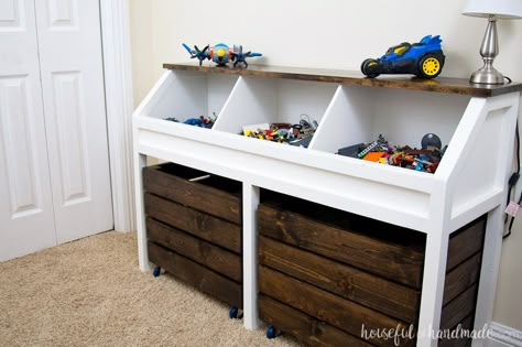 Organize the piles of toys in this toy storage console. Three open bins on top hold smaller toys and two large rolling bins hold larger toys. A rustic console that can easily grow with your child. Rustic Toys, Toy Storage Units, Toy Storage Ideas, Kids Toy Boxes, Diy Toy Storage, Toy Storage Bins, Kids Toy Organization, Diy Rustic Decor, Organizing Hacks