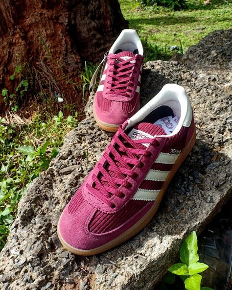 Adidas Handball Spezial Shadow Red Corduroy Donning a brilliant execution of materials that elevate its design from your typical terrace shoe. This fashion staple incorporates dark, burgundy-like shades of red throughout its premium corduroy uppers that are reinforced with rich suede overlays covering the toe, rear, and eyestays. underfoot is a plush Ortholite sockliner propped up by a semi-translucent gum sole for additional comfort. Adidas Handball Spezial, Adidas Handball, Dark Burgundy, Shades Of Red, Gum, Terrace, Shades, Adidas, Red