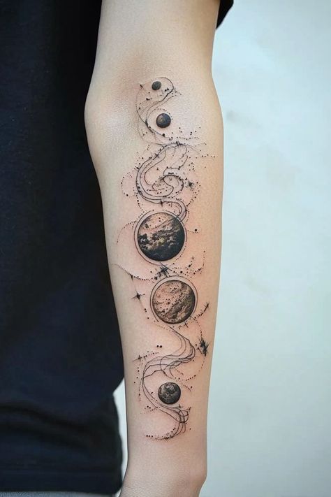 A detailed black and grey planet arm tattoo for women showcasing a celestial theme with connected planets. Tattoo Female Shoulder, Planetary Tattoo, Child Of The Universe Tattoo, Astronomy Tattoo Ideas, Geometric Space Tattoo, Planets Tattoo Design, Earth Tattoo Design, Tricep Tattoos Women, Astronomical Tattoo