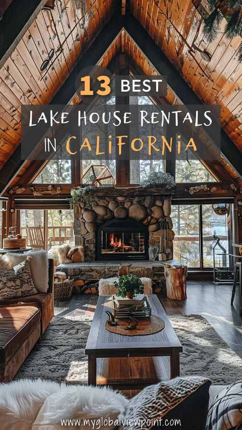 A cozy interior of a rustic lake house featuring a stone fireplace, wooden beams, and large windows overlooking a scenic lake surrounded by trees, one of the coolest lake house Airbnbs in California. Lake House Rentals, Lakeside Retreat, Mountain Cabins, Lakes In California, Lake Houses, California Vacation, Lakefront Homes, Lake House Decor, Vacation Home Rentals