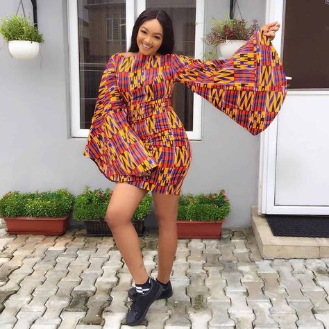 Mini Gown With Bell Sleeves Ankara Short Gown Styles With Sneakers, Short Gown Ankara Styles, Short Flare Gown, Ankara Short Flare Gowns, Ankara Bubu Gown Styles, Sneaker Ideas, Short Gown Styles, Beautiful Ankara Styles, Ankara Short