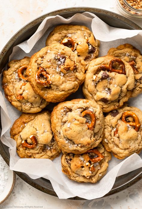 Overhead photo of nine kitchen sink cookies piled into a parchment paper-lined antique pan. Cookies With Pretzels, Freezable Cookies, Kitchen Sink Cookies Recipe, Sink Cookies, Kitchen Sink Cookies, Everything But The Kitchen Sink, Pretzel Cookies, Cookies Soft, Toffee Cookies