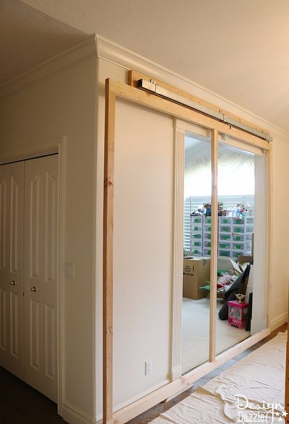 how to build a sliding wall in your home, home decor, how to Inside Sliding Doors, Diy Secret Room, Secret Room Doors, Fake Wall, Moveable Wall, Hidden Doors, Diy Sliding Door, Movable Walls, Kitchen Banquette