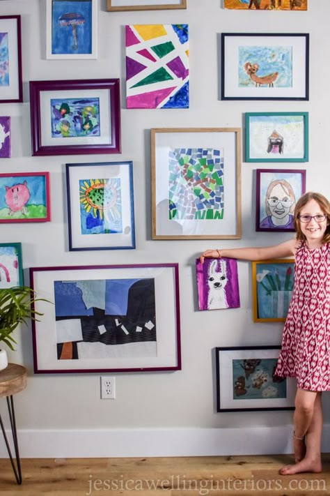 Create a fun and colorful kids' art display wall with inexpensive frames and spray paint! This is perfect for a playroom, homeschool room, kids' room, or anywhere in the home. Basement Vibes, Artwork Display Wall, Cool Hair Drawing, Playroom Homeschool Room, Diy Kids Art Display, Kids Art Display Wall, Playroom Paint, Colorful Gallery Wall, Homeschool Art Projects