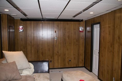 Wood paneled walls in basement Panel Wall Remodel, Remodel Wood Panel Walls, Covering Paneled Walls, Paneled Basement Makeover, Panel Basement Makeover, Wood Panel Bedroom Ideas, Wallpaper Basement Walls, How To Cover Wood Panel Walls, Wallpaper On Paneled Walls