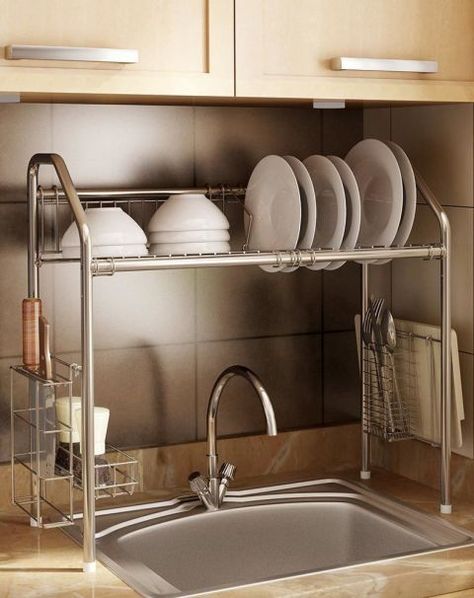 Flexible Steek Sink Storage Shelf: This vertical drying rack stores dishes on top and cutlery and utensils on the sides. Plus, you won't drip water when transferring items since it's positioned directly over the sink. Click through for more kitchen sink supplies you'll love. Over The Kitchen Sink, Apartemen Studio, Kitchen Sink Organization, Kabinet Dapur, Herringbone Backsplash, Dish Rack, Apartment Kitchen, Trendy Kitchen, Kitchen Remodel Idea