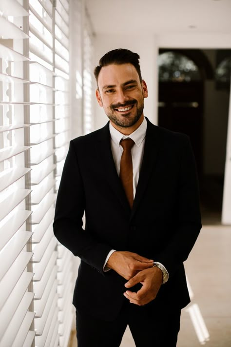 This groom looked classic in a black suit + burnt orange tie | Image by Thunder & Love Wedding Photography Black Suit Brown Tie, Sushi Wedding, Groom Attire Black, Grooms Outfit, Macrame Arch, South Africa Wedding, Grooms Suit, Rusting Wedding, Africa Wedding