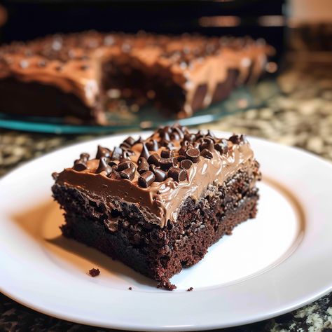 Baileys Chocolate Poke Cake is a decadent dessert that infuses the rich flavor of chocolate cake with the creamy, boozy kick of Baileys Irish Cream. The method of poking holes in the cake and drenching it with a Baileys and sweetened condensed milk mixture ensures every bite is moist and flavorful. Topped with hot fudge...Read More Baileys Chocolate Sheet Cake, Baileys Poke Cake Recipe, Baileys Chocolate Poke Cake, Bailey Chocolate Cake, Baileys Poke Cake, Irish Cream Chocolate Cake, Irish Cream Desserts, Baileys Irish Cream Cake, Irish Cream Cake