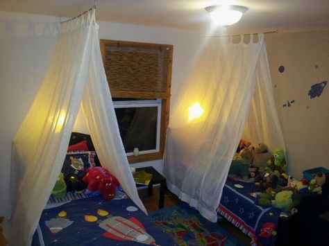 These are the tents I made for the kids by using old tab panel curtains, a pole and eye bolts. Super Easy! Tent Beds For Kids, Boys Canopy Bed Ideas, Boys Canopy Bed, Diy Bed Tent For Kids, Diy Tent Bed, Bed Tents For Boys, Boy Bed Canopy, Tent Beds For Kids Boys, Bed Tent Diy