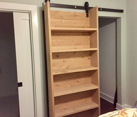 Our rad new sliding closet bookshelf barndoor -- Thanks Tommie Silva! Secret Bookcase Sliding Door, Sliding Door With Storage, Bathroom Storage Sliding Door, Diy Door Bookcase, Sliding Storage Doors, Sliding Door Shelves, Sliding Book Shelves, Sliding Door With Shelves, Bookshelf With Sliding Door