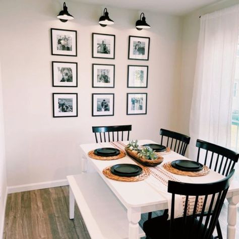 Lights Around Pictures On Wall, Picture Frames In Dining Room, Photo Wall Behind Dining Table, Photo Wall In Kitchen, Photo Wall Dinning Room, Dinning Room Picture Wall Ideas, Photo Wall In Dining Room, Black And White Picture Wall Living Room, Pictures With Lights Above