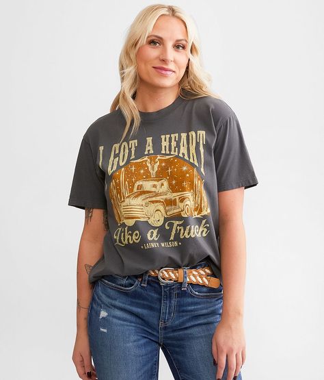 Lainey Wilson I Got A Heart Like A Truck Band T-Shirt - Grey Large, Women's Black Distressed graphic washed t-shirt Bust measures 39 on size small Body length 25 1/2 on size small. 100% Cotton. Machine wash cold. Do not bleach. Tumble dry low. Do not iron decoration.. Measurements: Bust -Fullest part of bust with arms at sides. Waist -Circumference of natural waist: above belly button below rib cage. Hips -Standing with feet together fullest part of hips. WOMEN'S TOP SIZE CONVERSION CHART Size U Lainey Wilson Shirts, Heart Like A Truck, Lainey Wilson, Heart Band, Iron Decoration, A Truck, Conversion Chart, Waist Circumference, Iron Decor