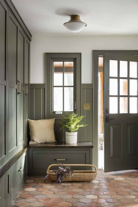 Inside a warm and inviting Minnesota lake house remodel on a woodsy setting Green Cabinet Mudroom, New England Mudroom, Green Mud Room Ideas, Modern Arts And Crafts Interior Design, Mudroom Door Interior, Old House Mudroom, Grandpa House Aesthetic, English Country Mudroom, Woodsy Cottage Interior