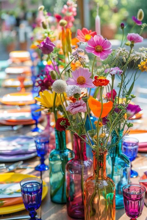 20 Beautiful Wildflower Centerpieces For Any Event • Coloured Glass Wedding, Colorful Bud Vases Wedding Centerpiece, Colourful Bud Vases, Flower Power Decorations, Wedding Round Table Settings, Colourful Wedding Table, Wild Flower Wedding, Flower Power Party, 2025 Graduation