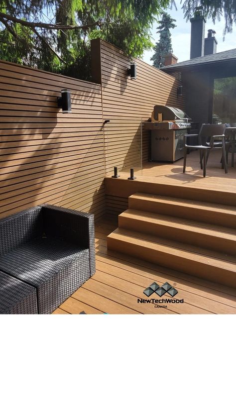 A composite decking project that also lead to a wall of privacy with our profile UH58 in the colour Teak #woodcomposite #compositedecking #expertadvice #deckingtips #installday #constructionproject #renovationproject #home #decking #outdoor #exteriordesign #houseinspo #patio #patioideas #deckingideas #deckingspecialist #wpcdecking #deckinggoals #deckingseason #warranty #newtechwood #ultrashield #terrasse #ideespatio #jardin #veranda #inspiration #landscaper # Composite Wall Cladding, Veranda Inspiration, Decking Outdoor, Composite Siding, Composite Cladding, Exterior Wall Cladding, Types Of Siding, Wpc Decking, Timber Battens