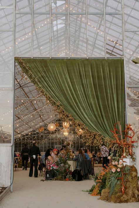 sage green velvet drapery and overgrown + organic floral installations for this eclectic greenhouse wedding reception Floral Print Wedding Dress, Hawaiian Wedding Dress, Greenhouse Venue, Wedding Drapery, Green Wedding Decorations, Blue Green Wedding, Draping Wedding, Greenhouse Garden, Greenhouse Wedding