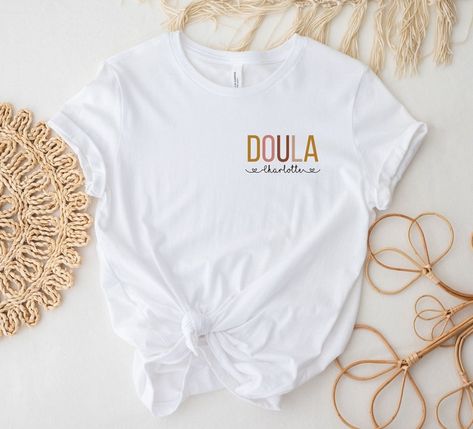 This shirt is the perfect gift for doulas. Either to thank your doula for her support or to make a doula friend happy. The personalization with her name makes it a very unique personal gift. Midwife Gift, Birth Support, Midwife Shirt Midwife Shirt, Doula Gifts, Midwife Gift, Unique Personalized Gift, Holding Hands, The Year, Personalized Gifts, Perfect Gift, T Shirts