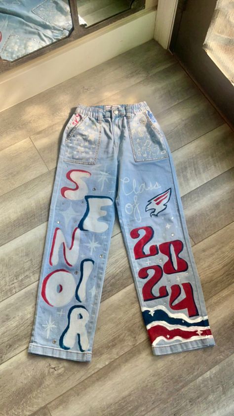 Painted Pants For Homecoming, Sr Painted Jeans, Hoco School Spirit Day, Decorated Senior Jeans, Class Of 2024 Jean Ideas, Grad Coveralls Ideas, Homecoming Pants Idea, Decision Day Jeans, Class Of 2024 Ideas