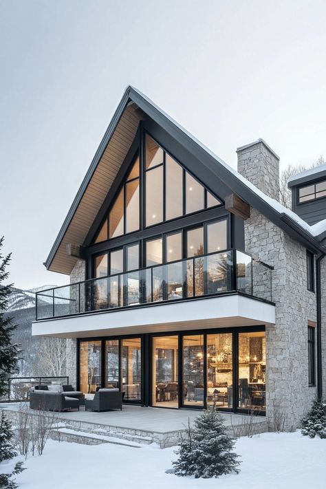 Modern A-frame stone house in snowy setting. From rustic mountain retreats to urban lofts with views worth a million bucks (or maybe we’re just out of breath from the altitude), Colorado homes have their very own kind of charm. Modern Mountain Home Walk Out Basement, Contemporary Mountain Home Exterior, Mountain Villa Design, Mountain Side Homes, Rustic Modern Cabin Interior, Mountain Homes Interiors, Houses In The Mountains, Modern Mountain Home Exterior, Colorado Houses