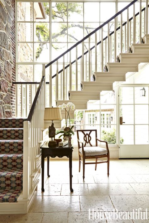 The addition of a dramatic two-story glass wall behind the floating back stairway floods the space with sunlight. Cathy Kincaid, Foyer Staircase, Dallas House, Foyer Modern, Decorate Entryway, Pallet Decorations, Floating Staircase, Valentines Decorations, Foyer Decorating