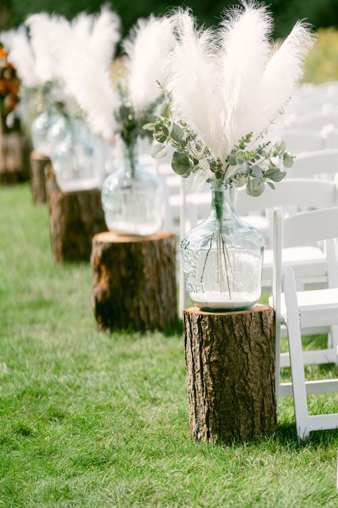 Glass Jug Aisle Decor, Pampas Grass Isle Wedding Decor, Amber Jugs Wedding Aisle, Glass Jug Wedding Aisle, Pampas Grass In Jugs Wedding, Boho Aisle Decor, Carboy Jug Decor Wedding, Glass Jug Wedding Decor, Pompous Grass Wedding Aisle