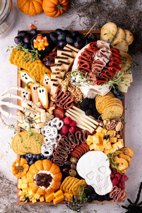 The best Halloween charcuterie board with ideas for skeleton pretzels, ghost peppers, candy corn buckets, and skull cheese! Tons of ideas that work for kids, teens, and even adults! Perfect for your next Halloween meal or snack! Skeleton Pretzels, Halloween Cheese Board, Halloween Charcuterie Board Ideas, Kid Holiday Games, Disney Party Games, Halloween Meal, Halloween Charcuterie Board, Charcuterie Appetizers, Halloween Charcuterie